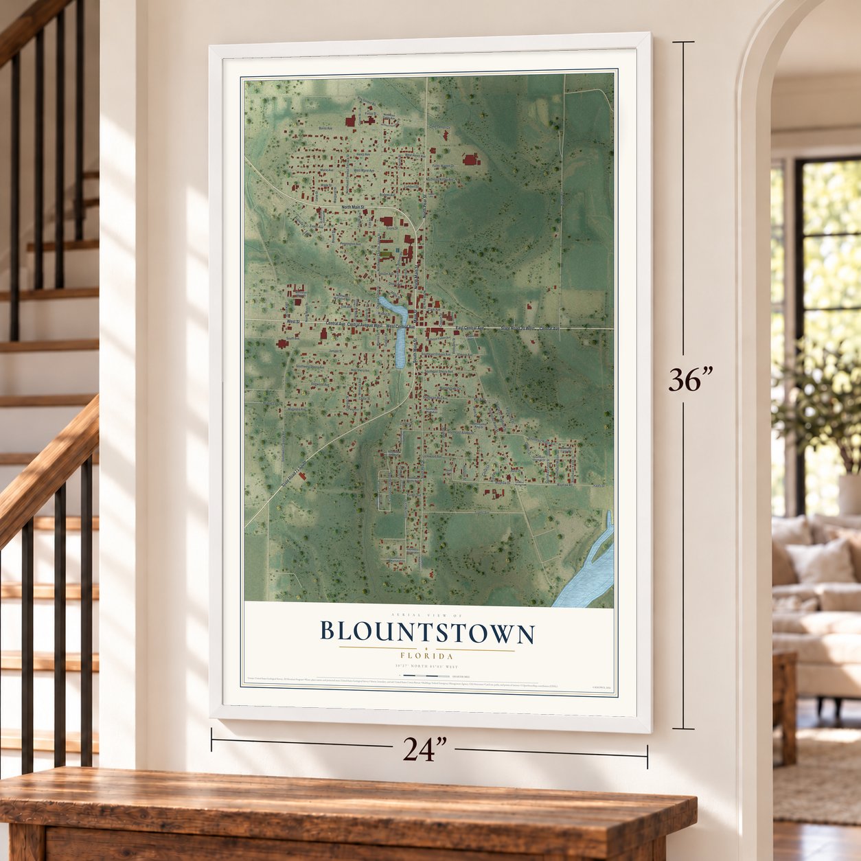 Blountstown, Florida map, 24 x 36 inch print in a white frame by a staircase