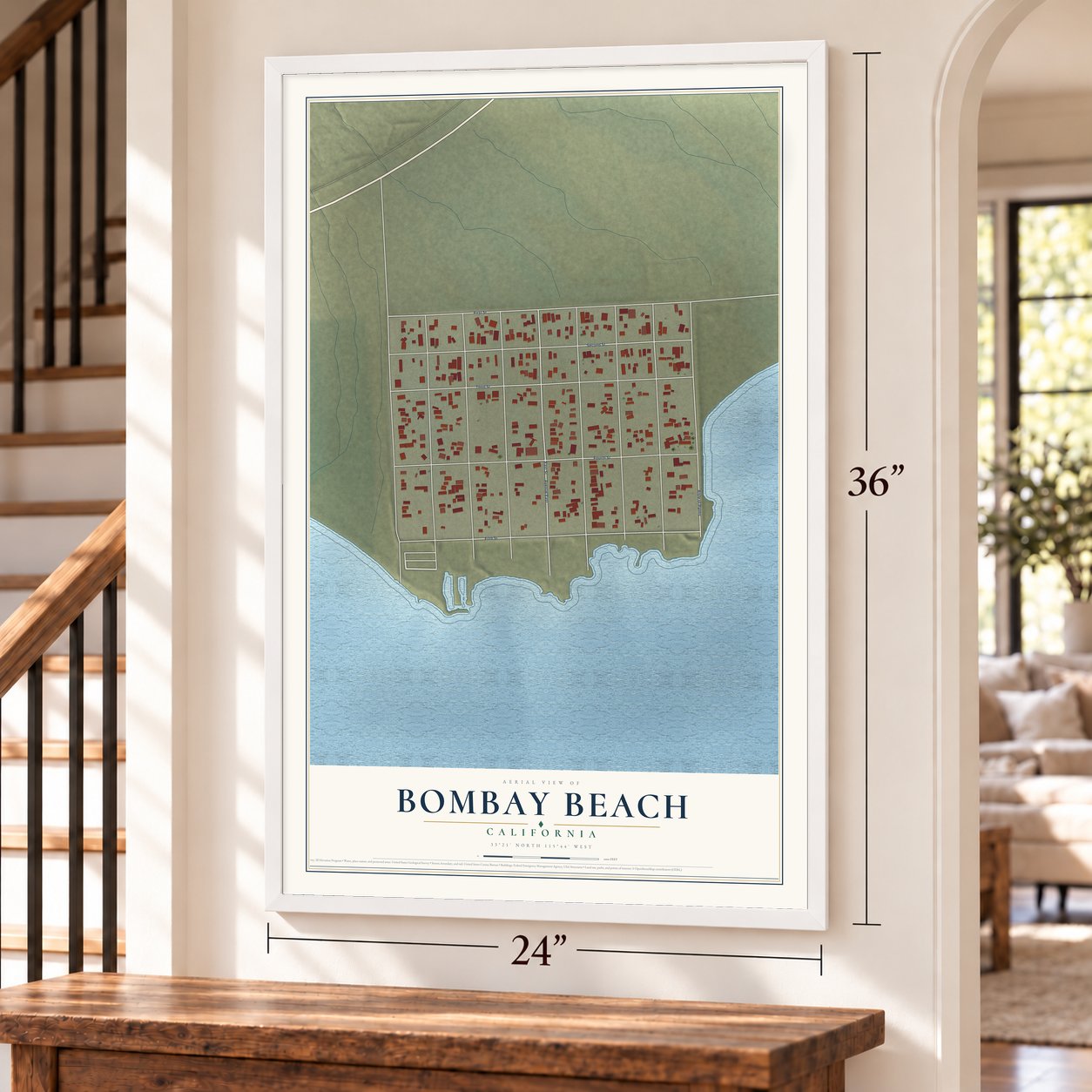 Bombay Beach, California map, 24 x 36 inch print in a white frame by a staircase
