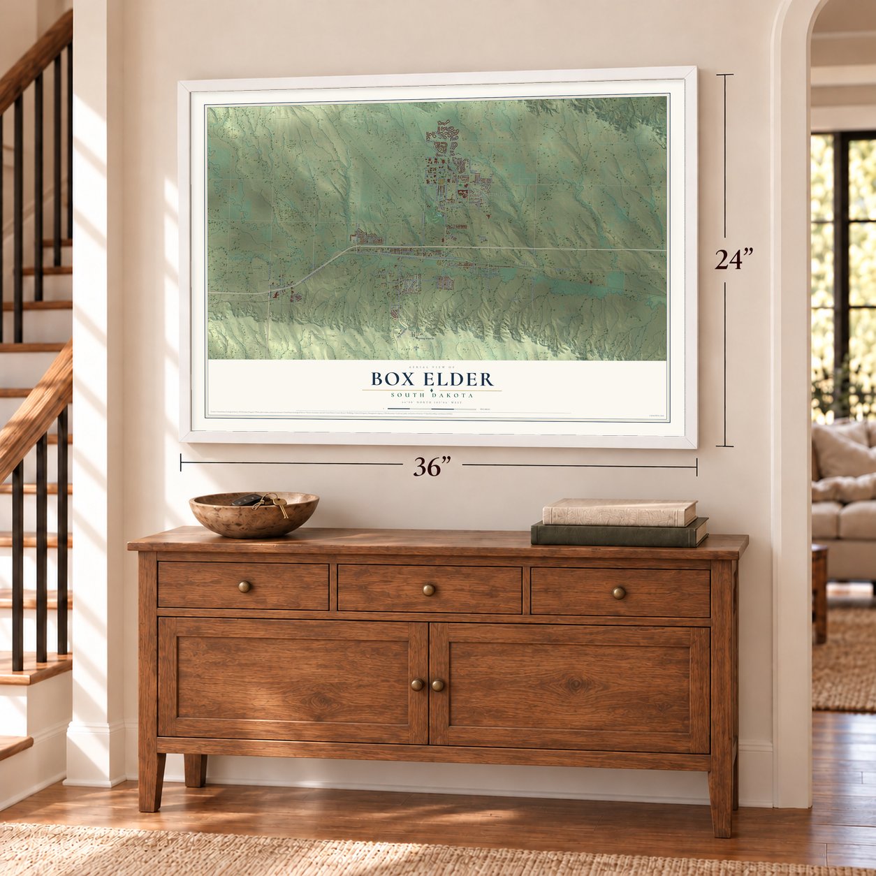 Box Elder, South Dakota map, 24 x 36 inch print in a white frame above a dresser by a staircase