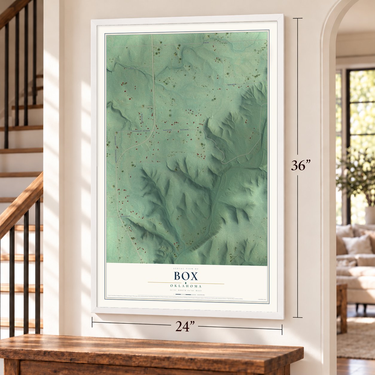 Box, Oklahoma map, 24 x 36 inch print in a white frame by a staircase