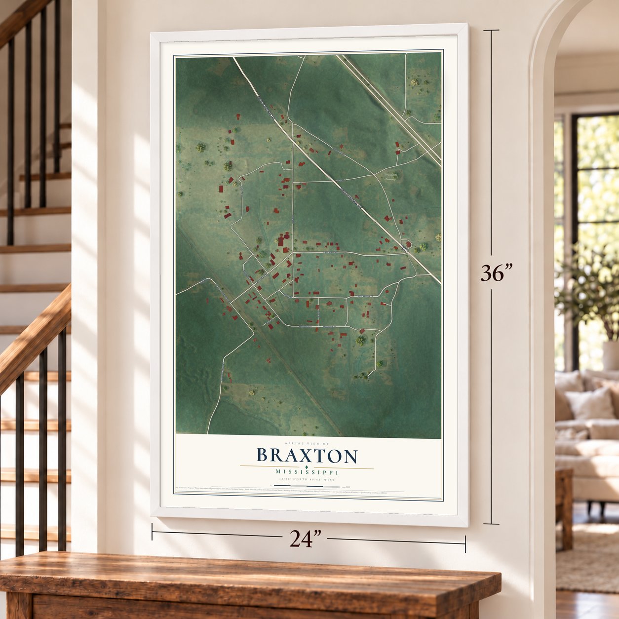 Braxton, Mississippi map, 24 x 36 inch print in a white frame by a staircase
