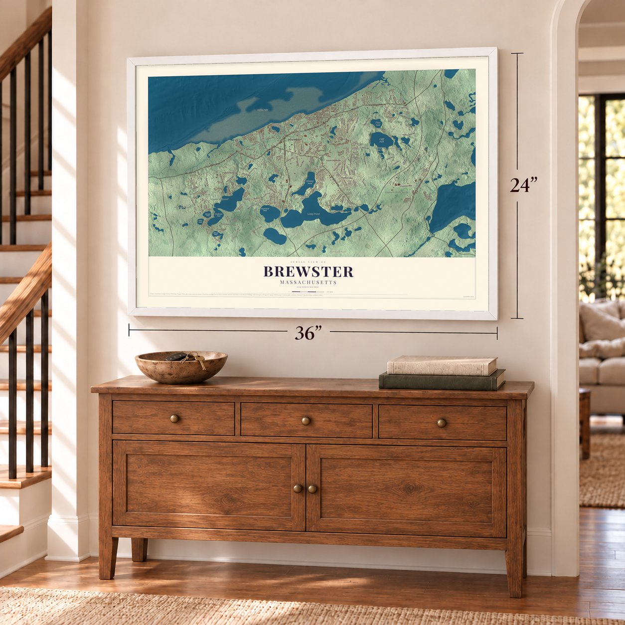 Brewster, Massachusetts map, 24 x 36 inch print in a white frame above a dresser by a staircase