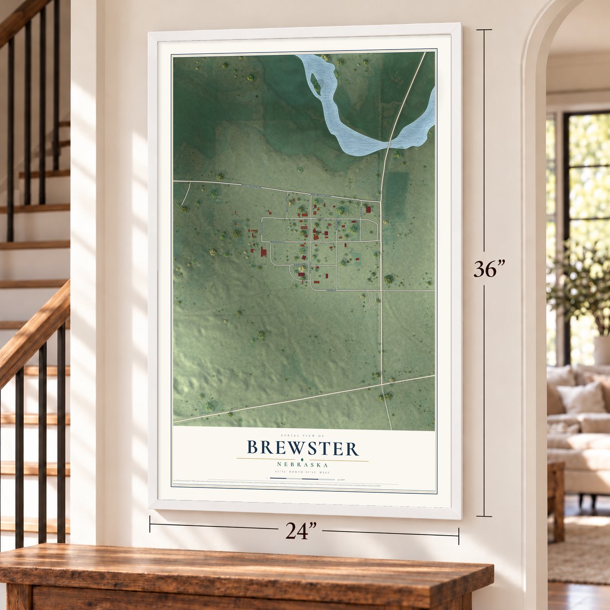 Brewster, Nebraska map, 24 x 36 inch print in a white frame by a staircase