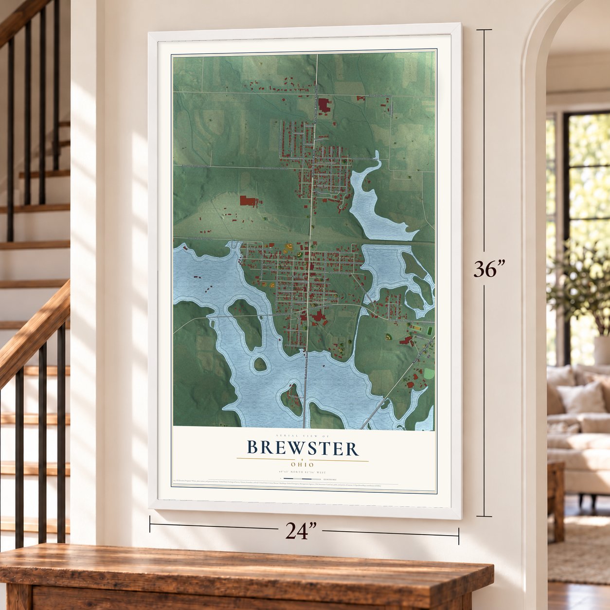 Brewster, Ohio map, 24 x 36 inch print in a white frame by a staircase