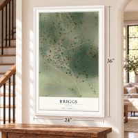 Briggs, Texas map, 24 x 36 inch print in a white frame by a staircase