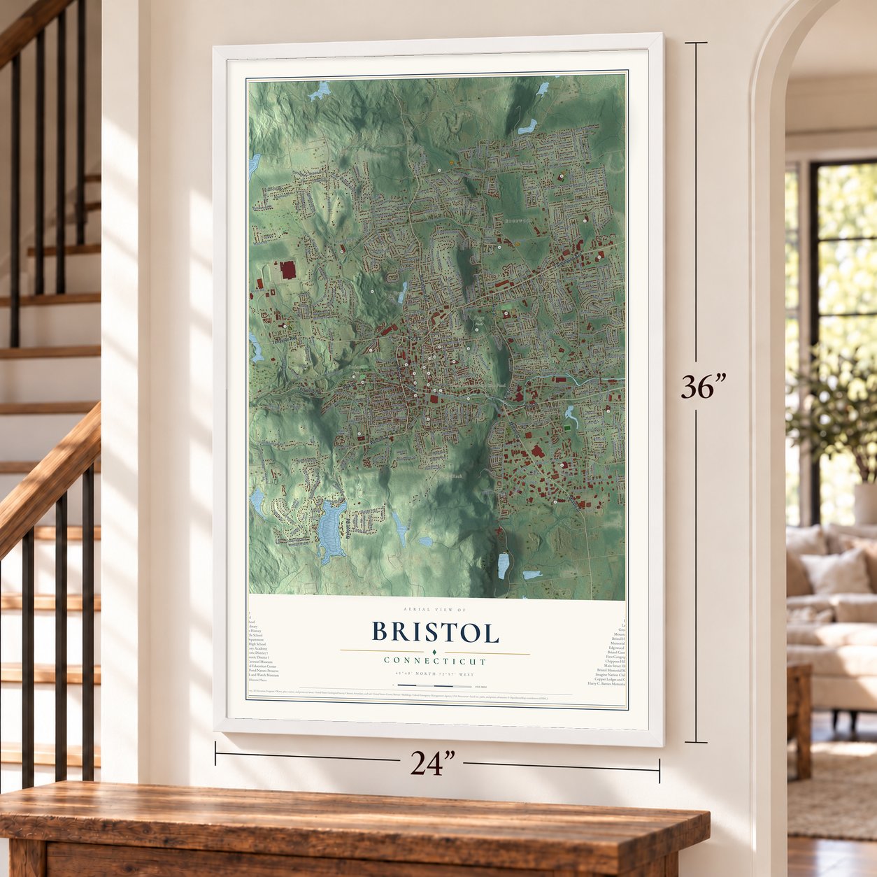 Bristol, Connecticut map, 24 x 36 inch print in a white frame by a staircase