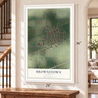 Brownstown, Illinois map, 24 x 36 inch print in a white frame by a staircase