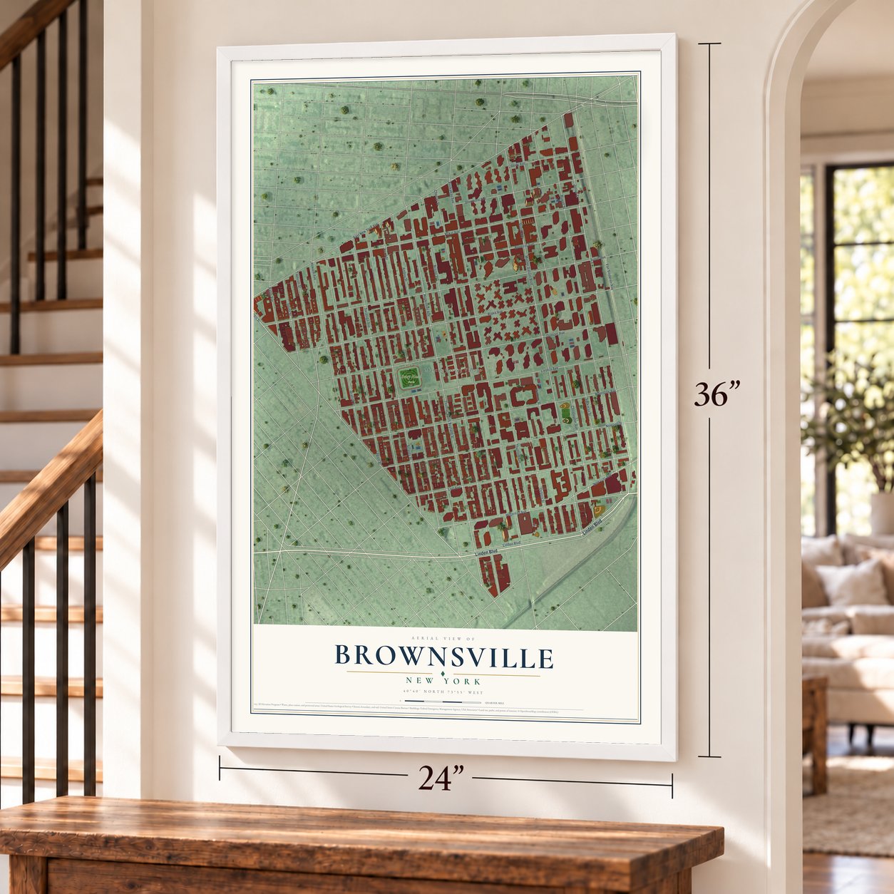 Brownsville, New York map, 24 x 36 inch print in a white frame by a staircase