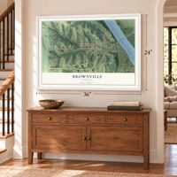 Brownville, Nebraska map, 24 x 36 inch print in a white frame above a dresser by a staircase