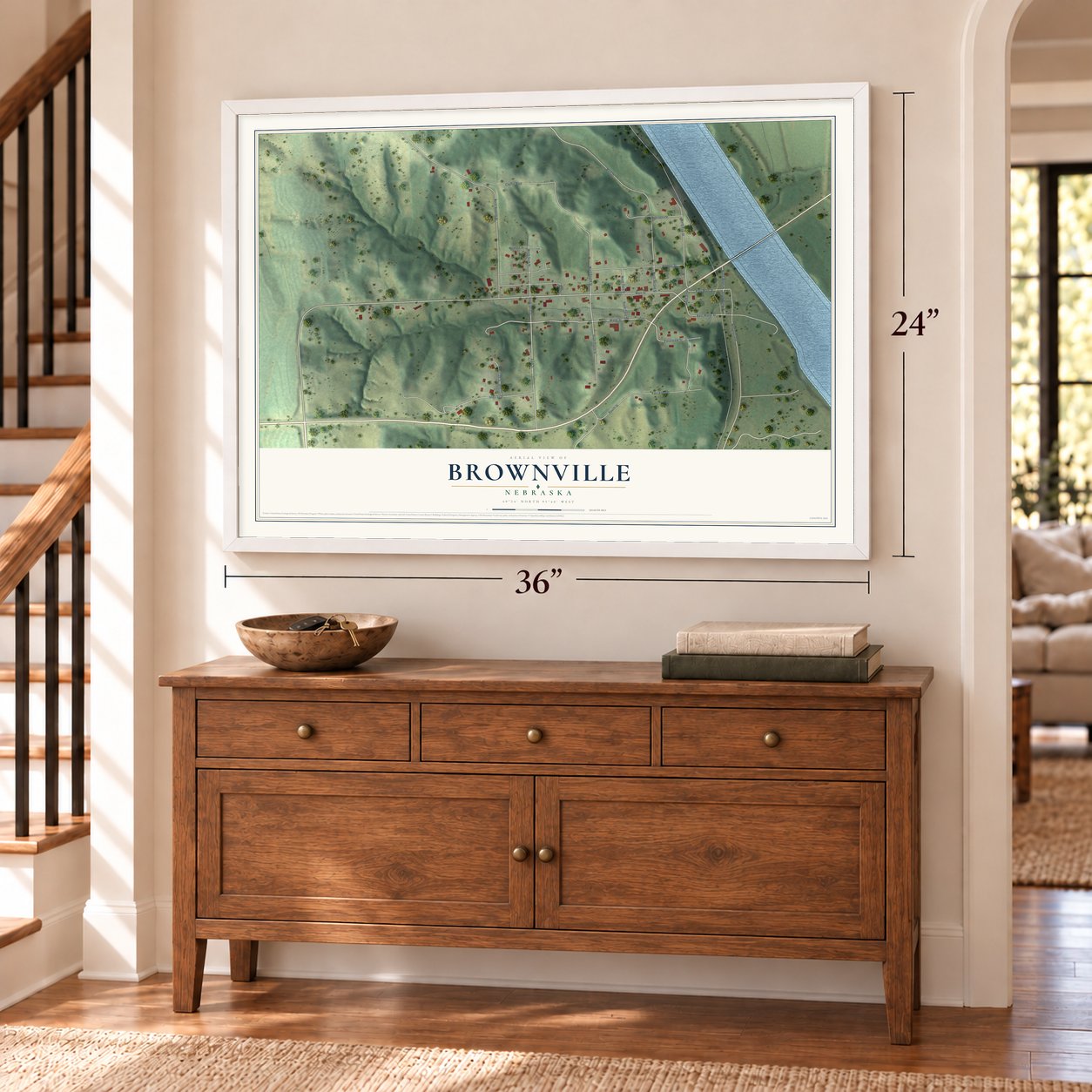 Brownville, Nebraska map, 24 x 36 inch print in a white frame above a dresser by a staircase