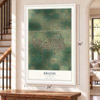 Brush, Colorado map, 24 x 36 inch print in a white frame by a staircase