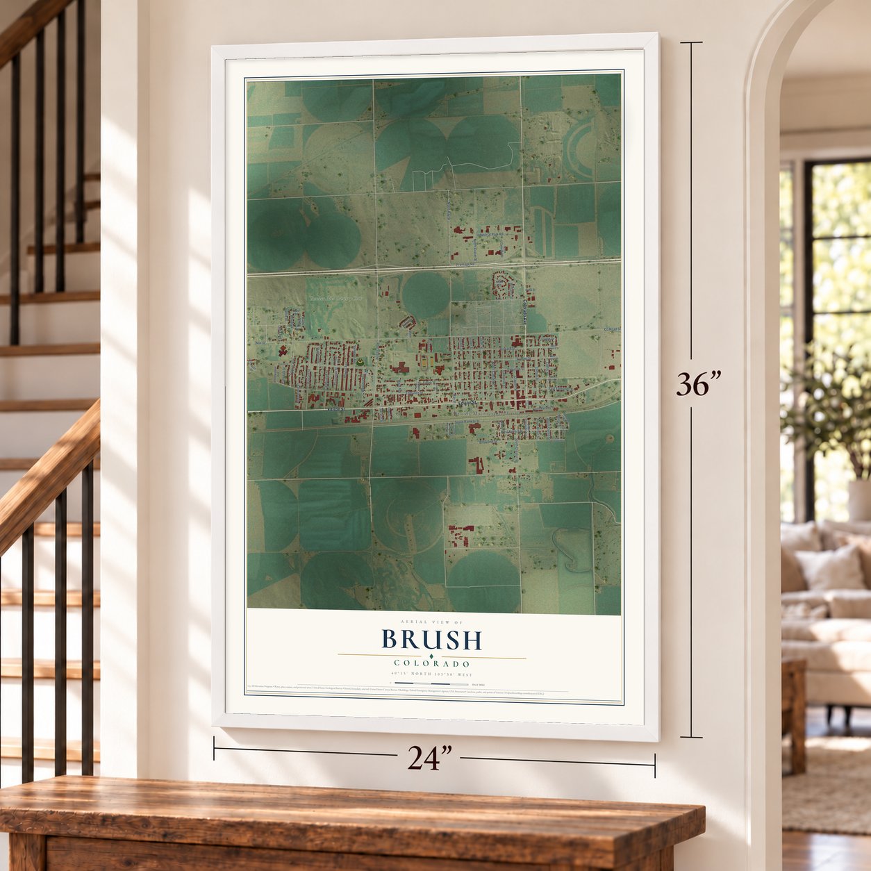 Brush, Colorado map, 24 x 36 inch print in a white frame by a staircase