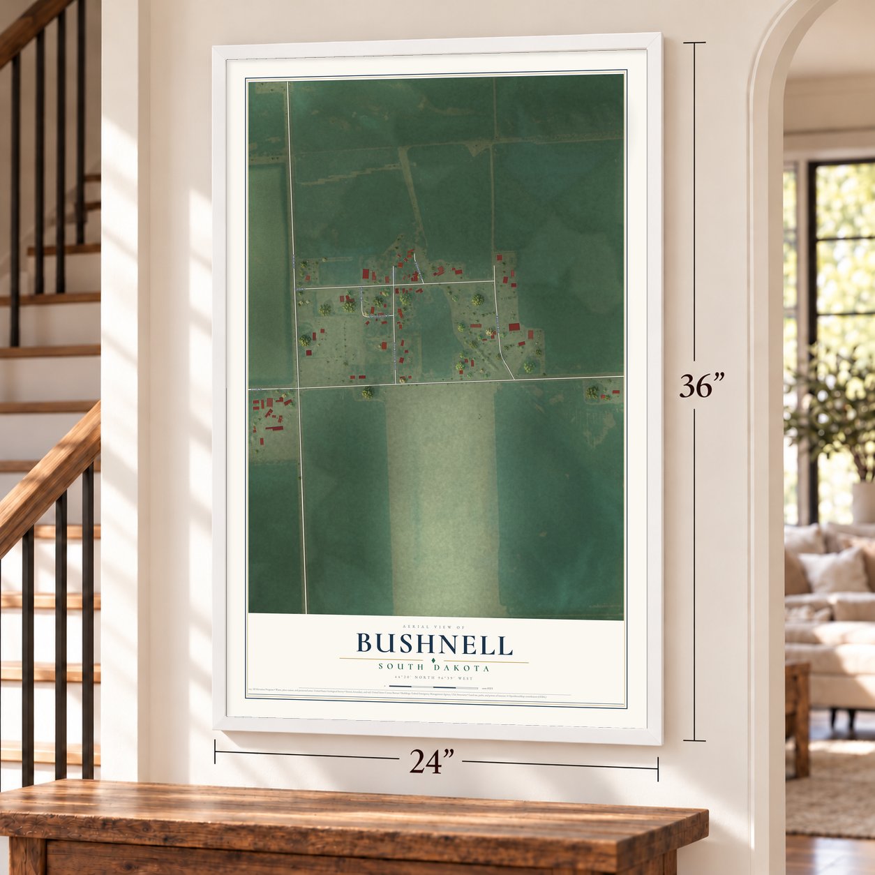 Bushnell, South Dakota map, 24 x 36 inch print in a white frame by a staircase