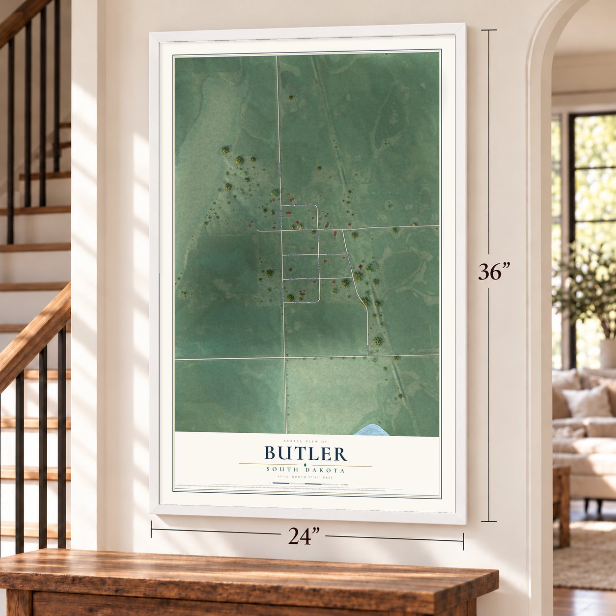 Butler, South Dakota map, 24 x 36 inch print in a white frame by a staircase