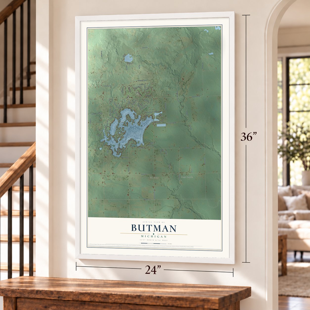 Butman, Michigan map, 24 x 36 inch print in a white frame by a staircase