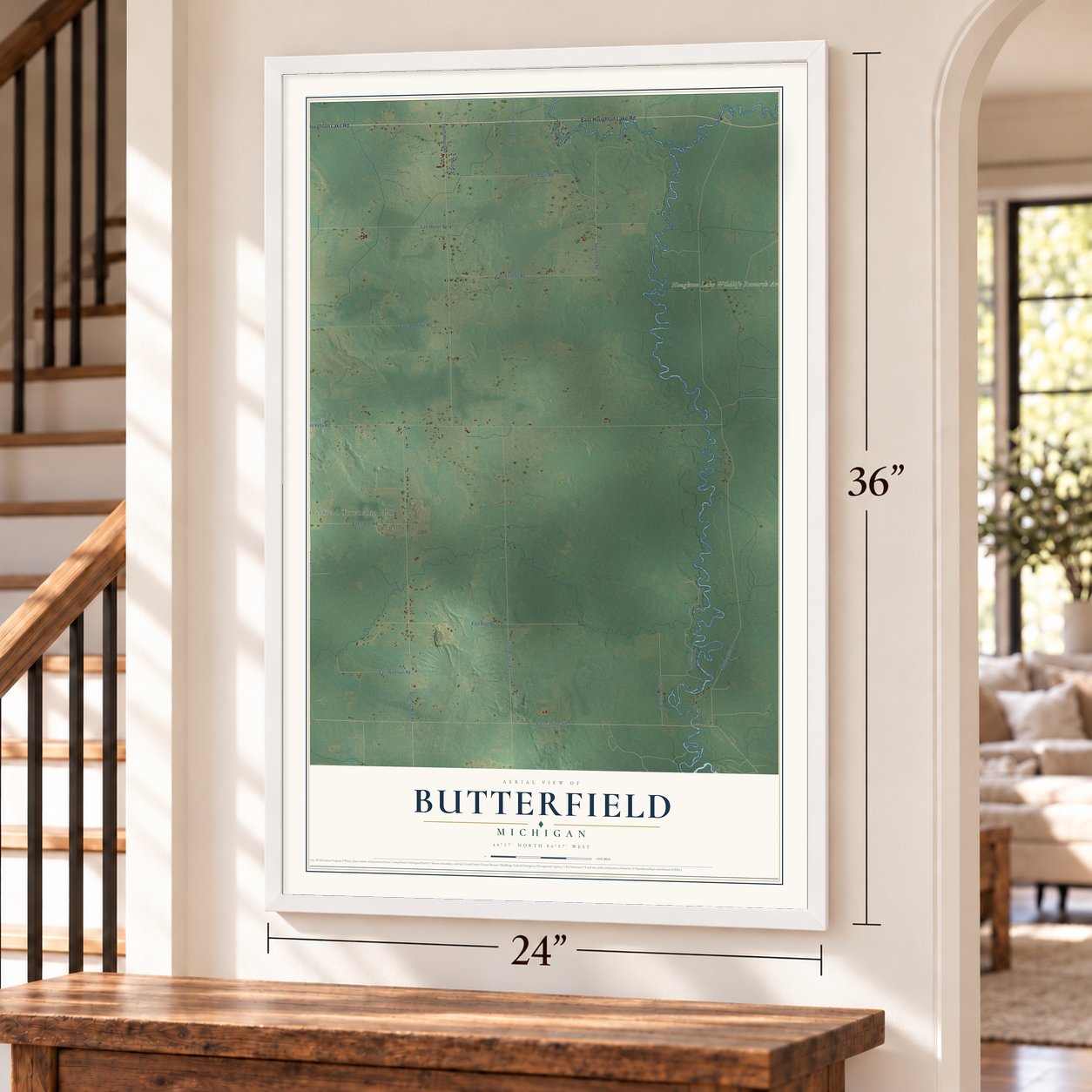 Butterfield, Michigan map, 24 x 36 inch print in a white frame by a staircase