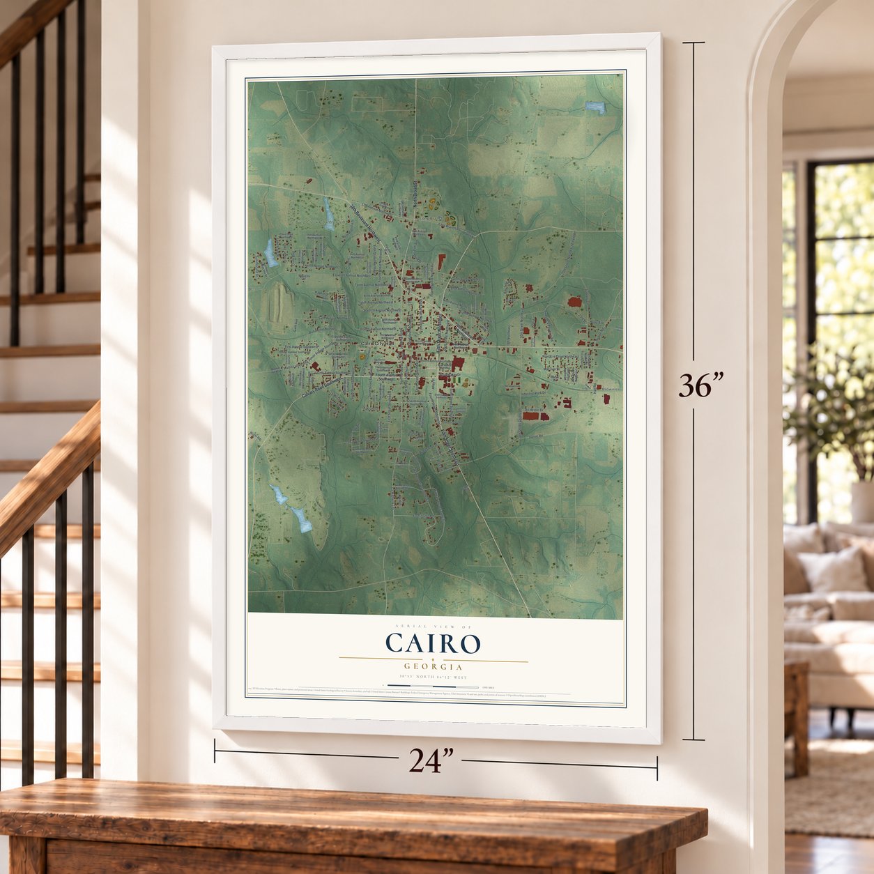 Cairo, Georgia map, 24 x 36 inch print in a white frame by a staircase
