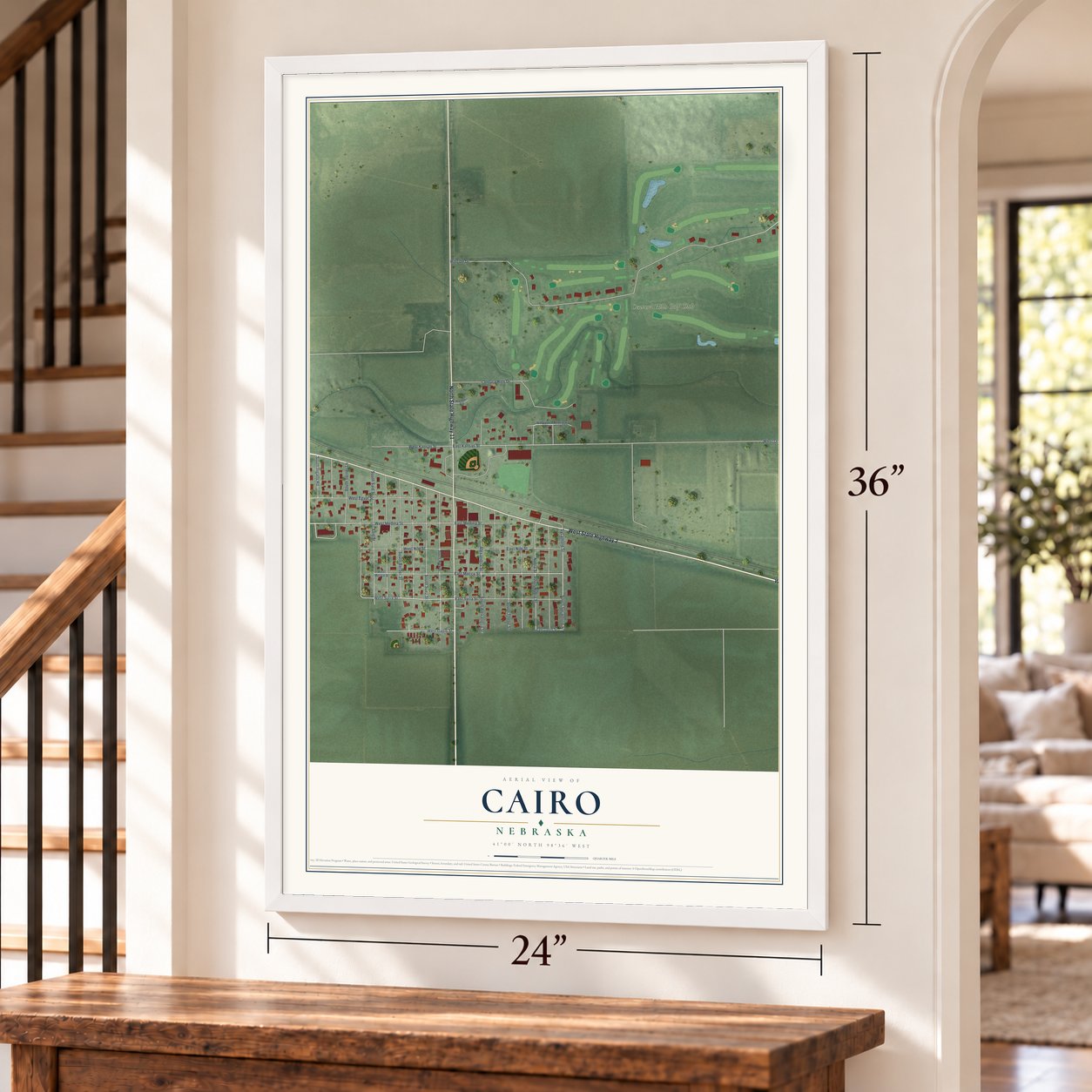 Cairo, Nebraska map, 24 x 36 inch print in a white frame by a staircase