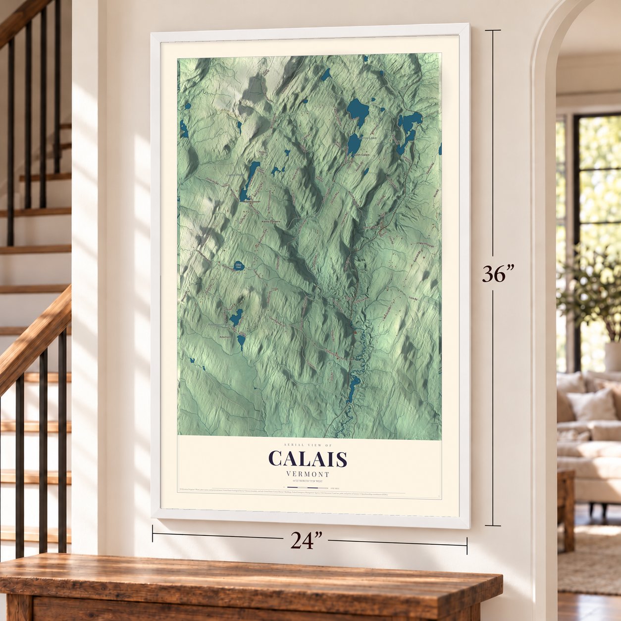Calais, Vermont map, 24 x 36 inch print in a white frame by a staircase