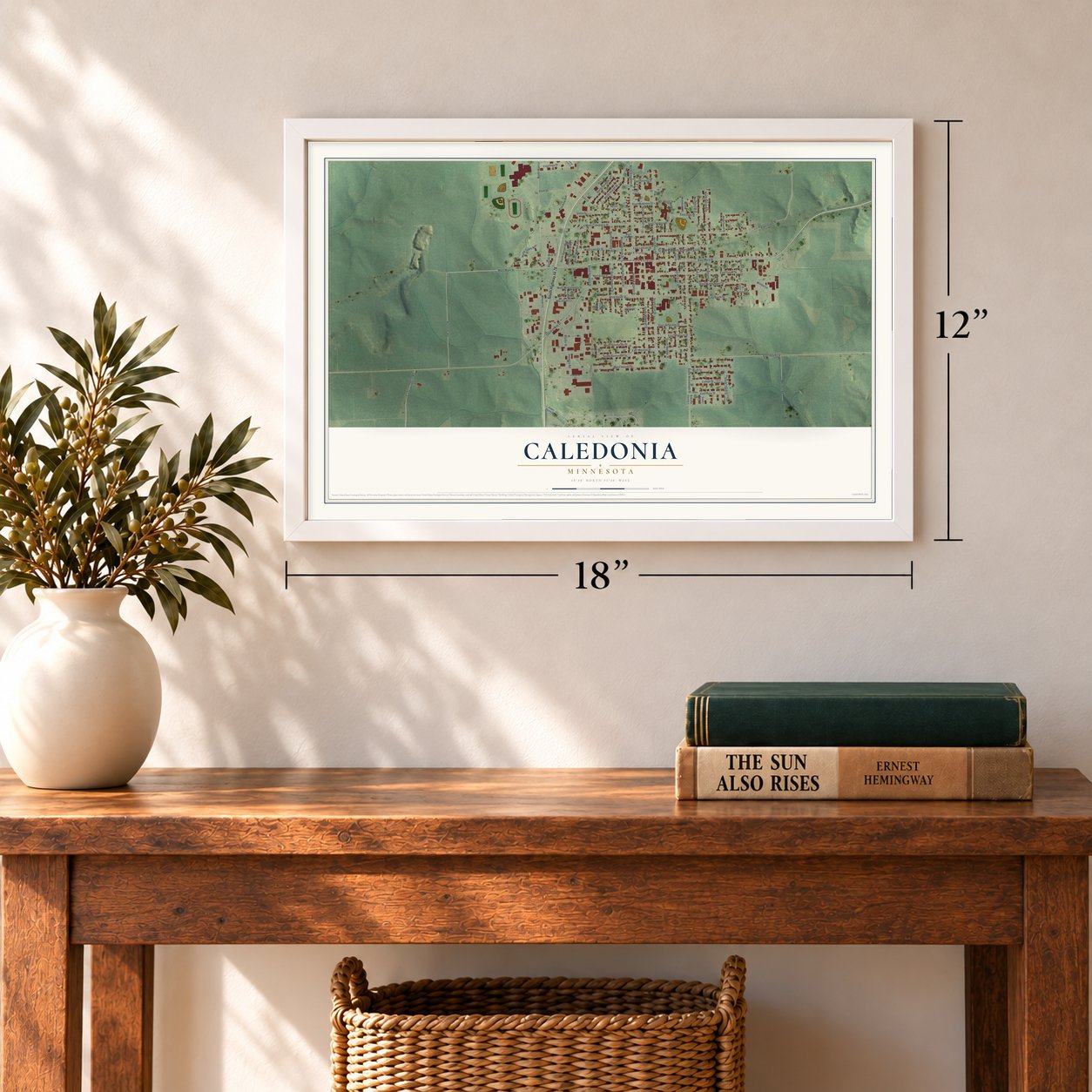 Caledonia, Minnesota map, 12 x 18 inch print in a white frame in an entryway