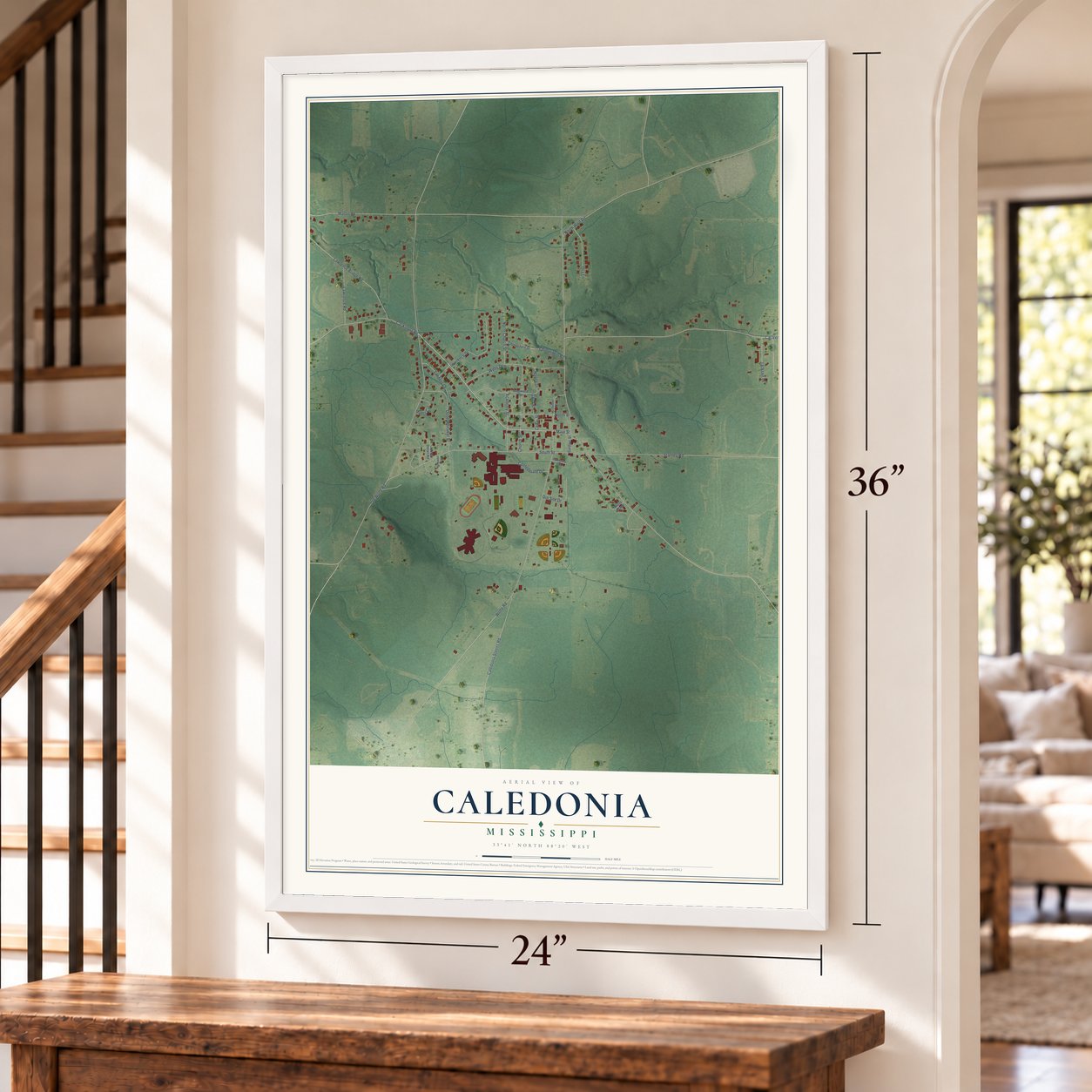 Caledonia, Mississippi map, 24 x 36 inch print in a white frame by a staircase