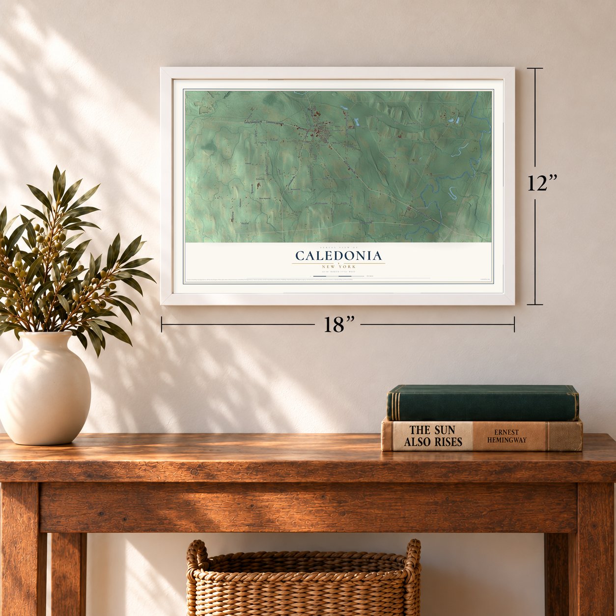 Caledonia, New York map, 12 x 18 inch print in a white frame in an entryway