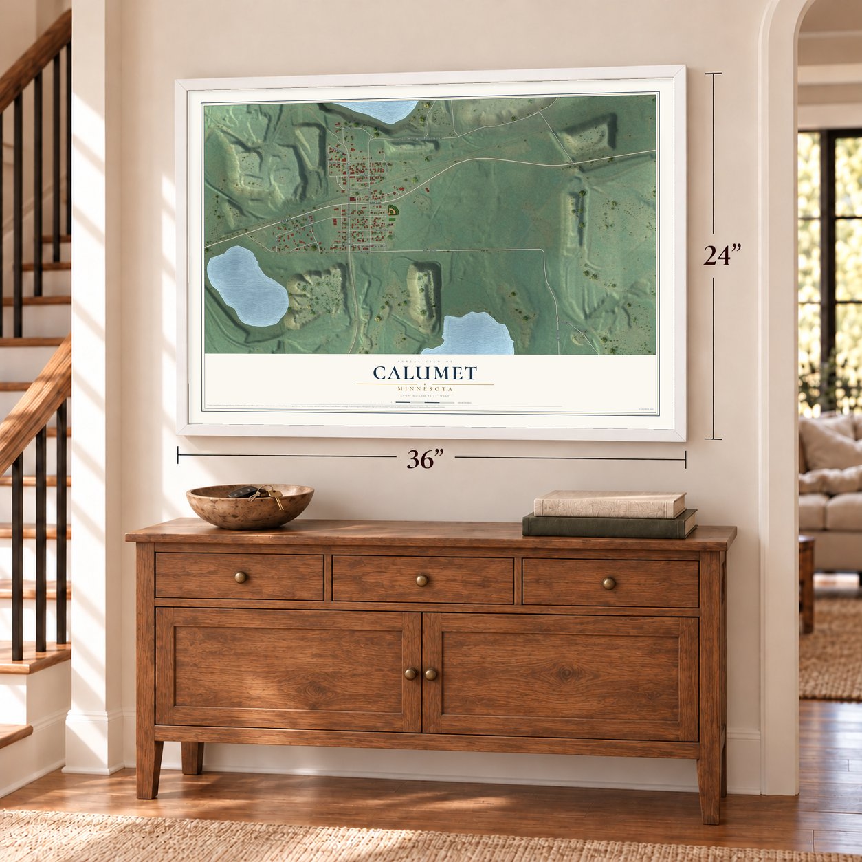 Calumet, Minnesota map, 24 x 36 inch print in a white frame above a dresser by a staircase
