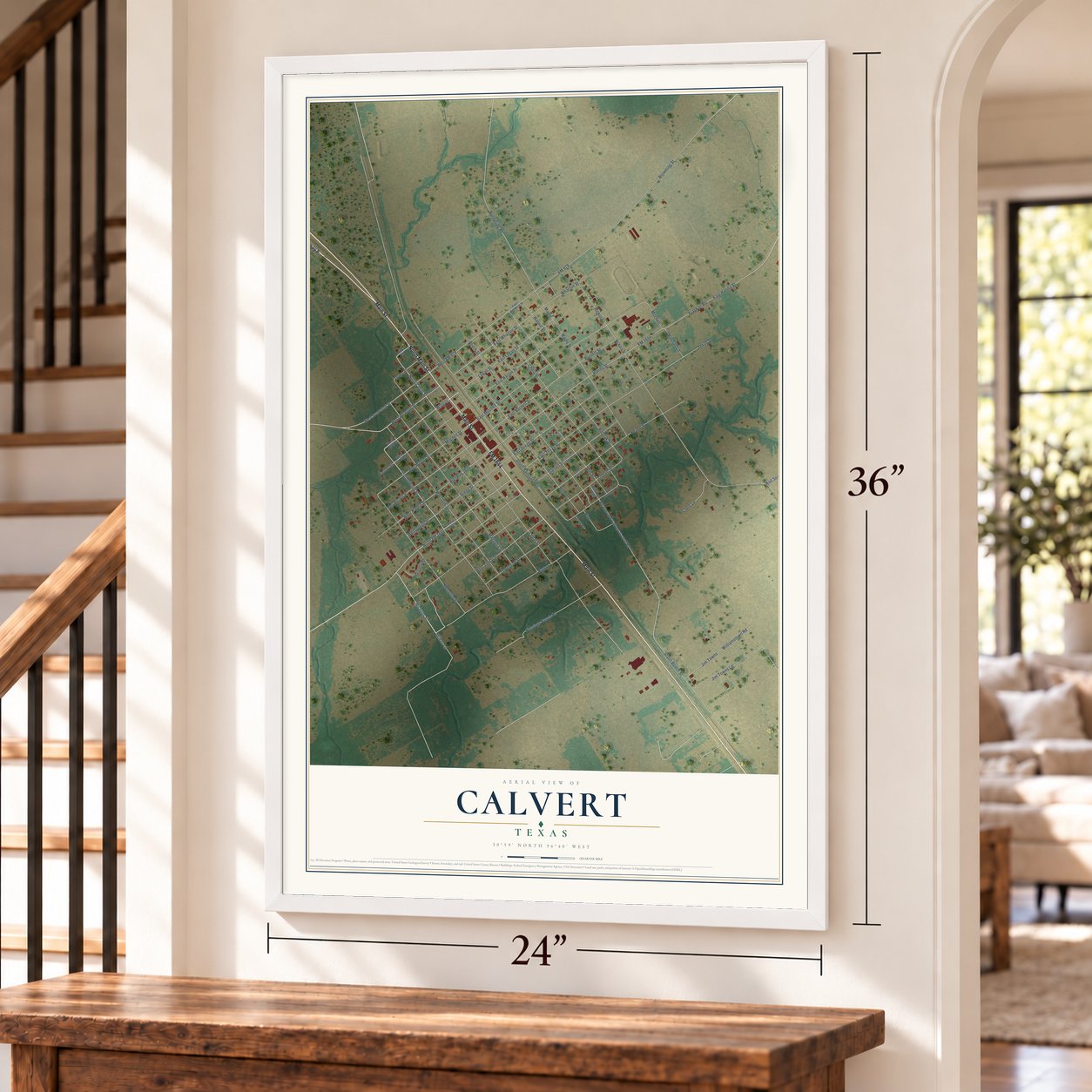 Calvert, Texas map, 24 x 36 inch print in a white frame by a staircase