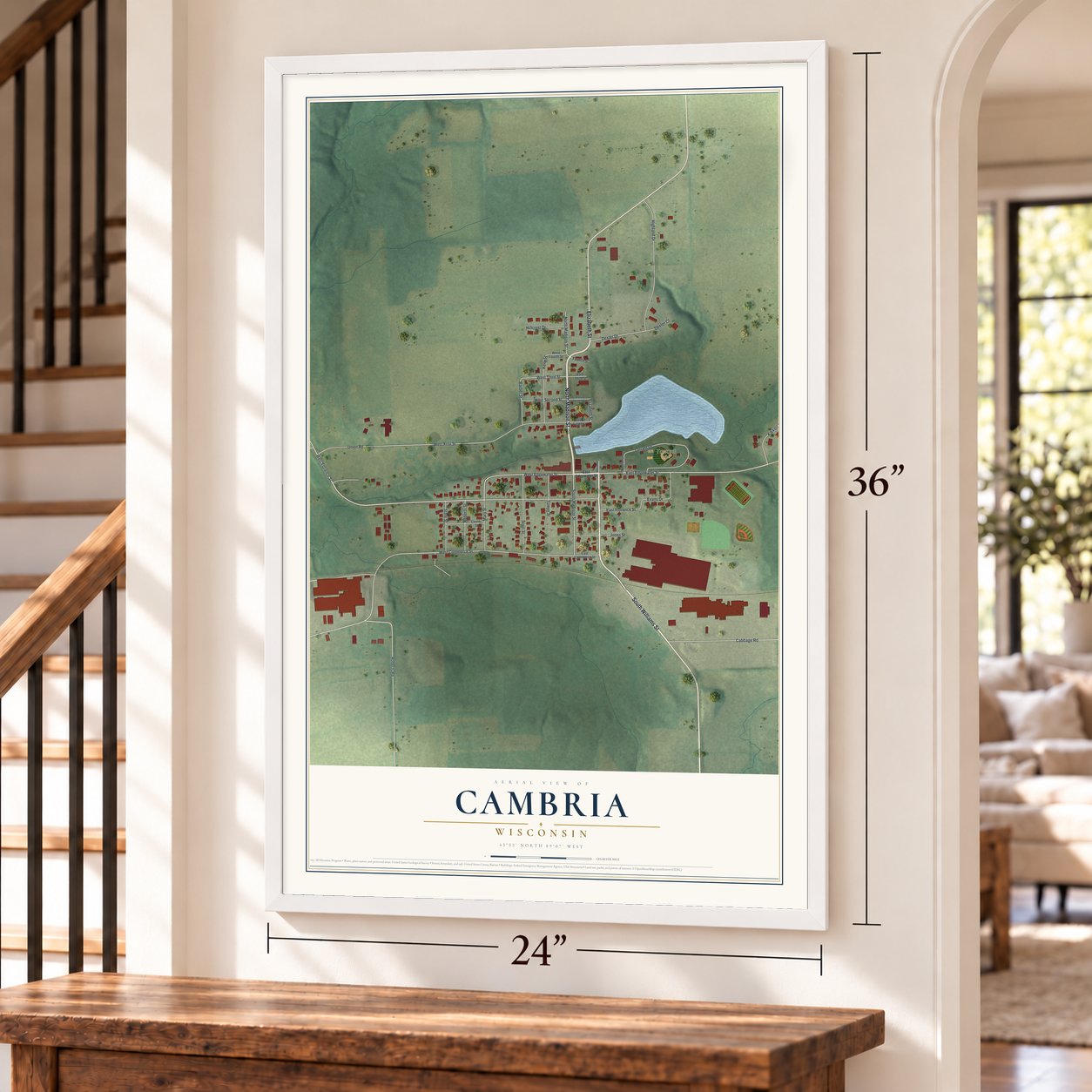 Cambria, Wisconsin map, 24 x 36 inch print in a white frame by a staircase