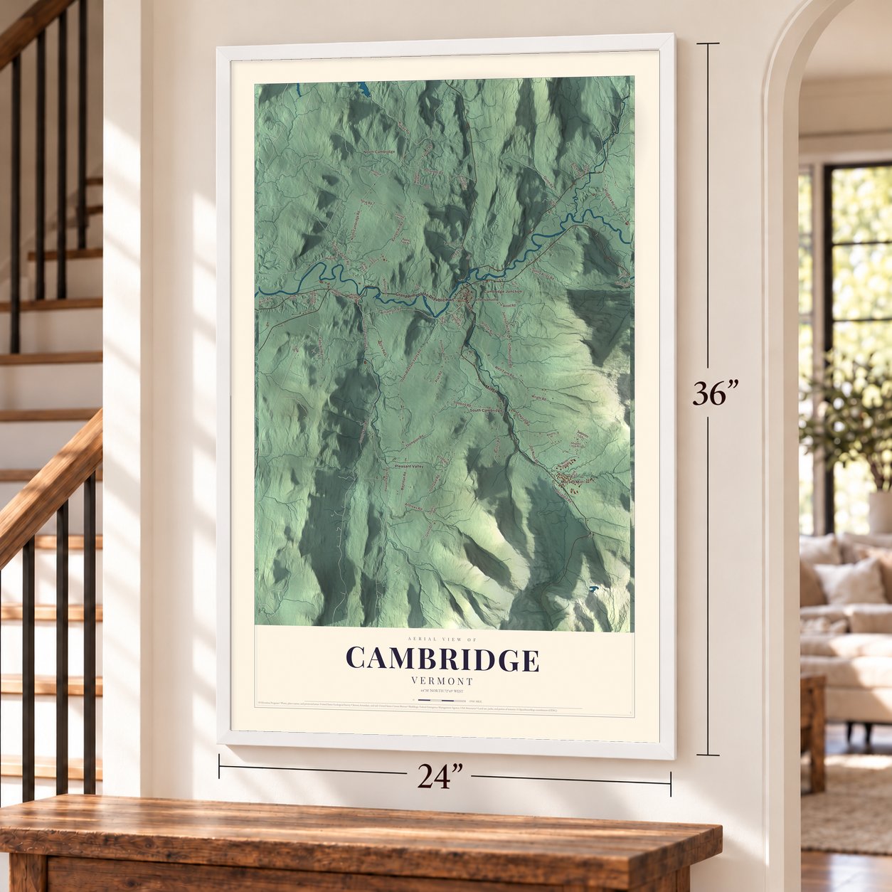 Cambridge, Vermont map, 24 x 36 inch print in a white frame by a staircase