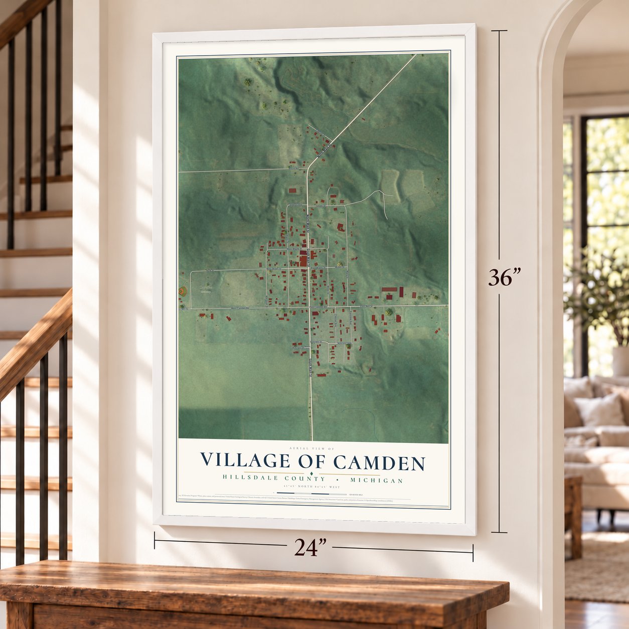 Camden, Michigan map, 24 x 36 inch print in a white frame by a staircase