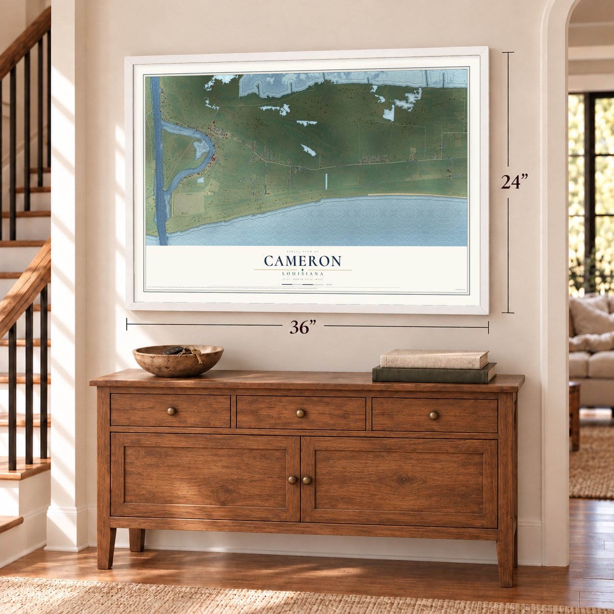 Cameron, Louisiana map, 24 x 36 inch print in a white frame above a dresser by a staircase