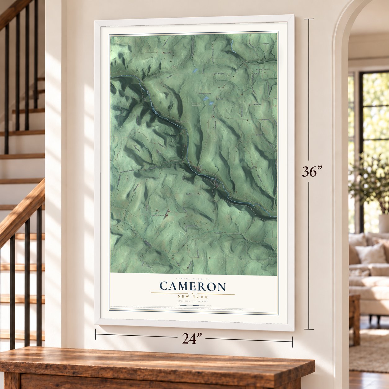 Cameron, New York map, 24 x 36 inch print in a white frame by a staircase