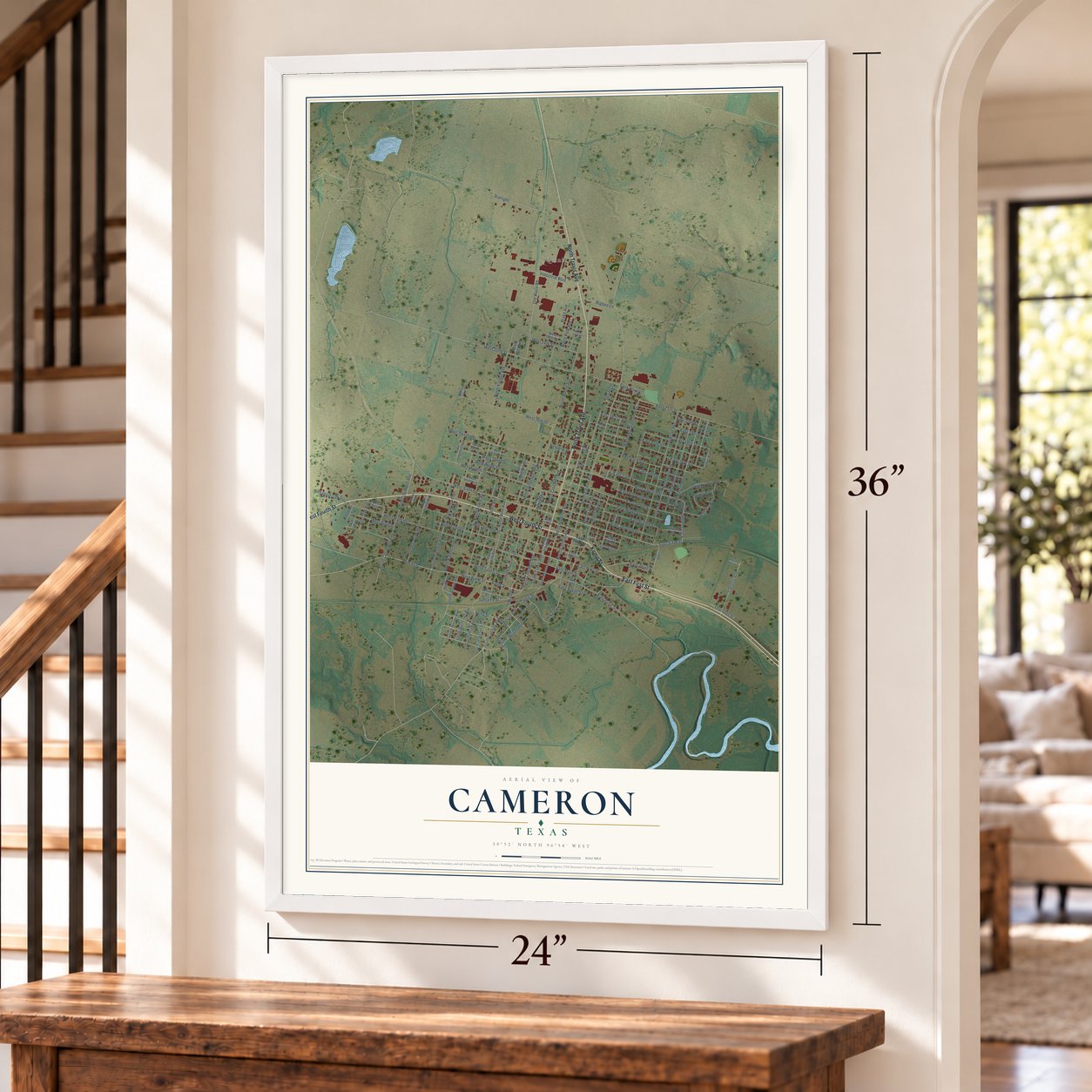 Cameron, Texas map, 24 x 36 inch print in a white frame by a staircase