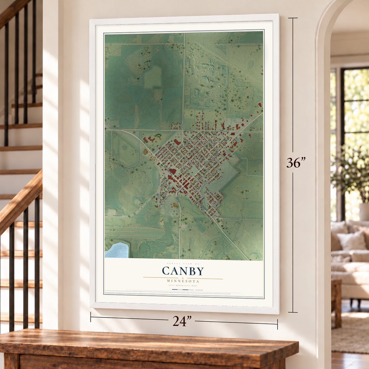 Canby, Minnesota map, 24 x 36 inch print in a white frame by a staircase