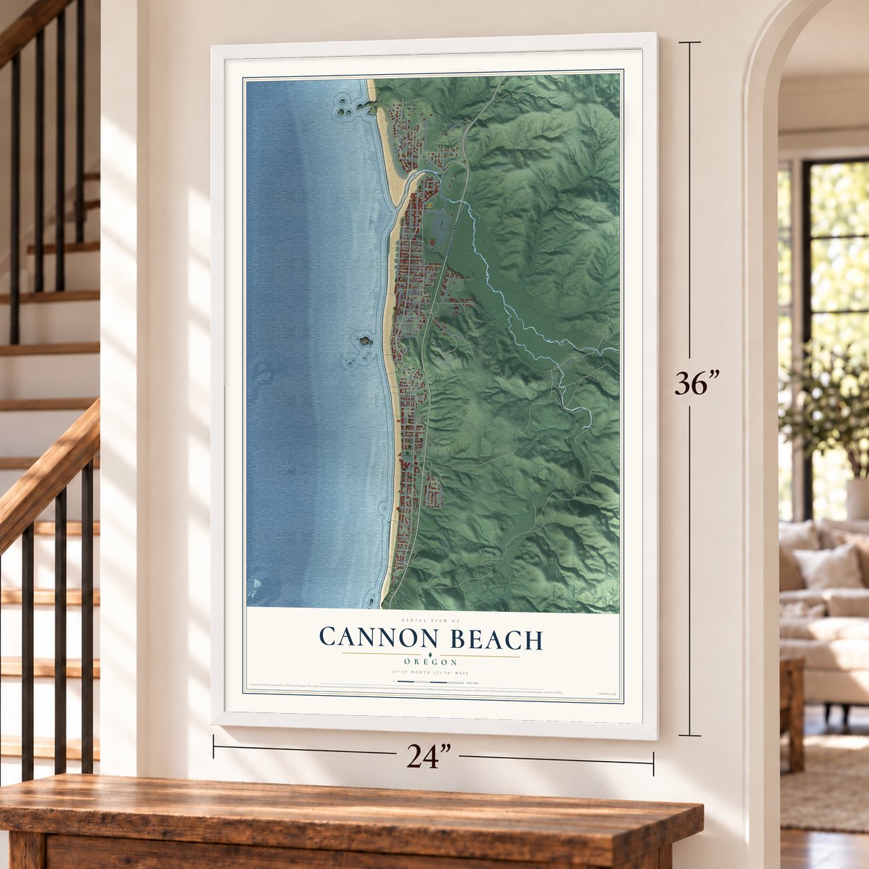 Cannon Beach, Oregon map, 24 x 36 inch print in a white frame by a staircase
