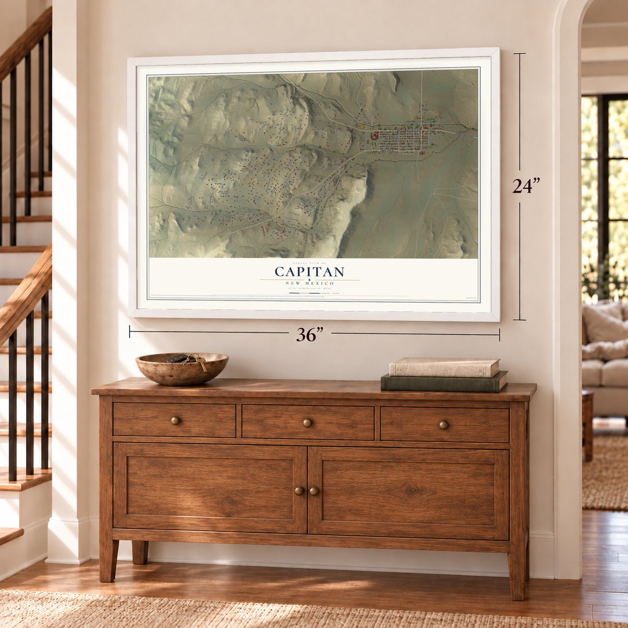 Capitan, New Mexico map, 24 x 36 inch print in a white frame above a dresser by a staircase