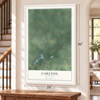Carlton, Michigan map, 24 x 36 inch print in a white frame by a staircase