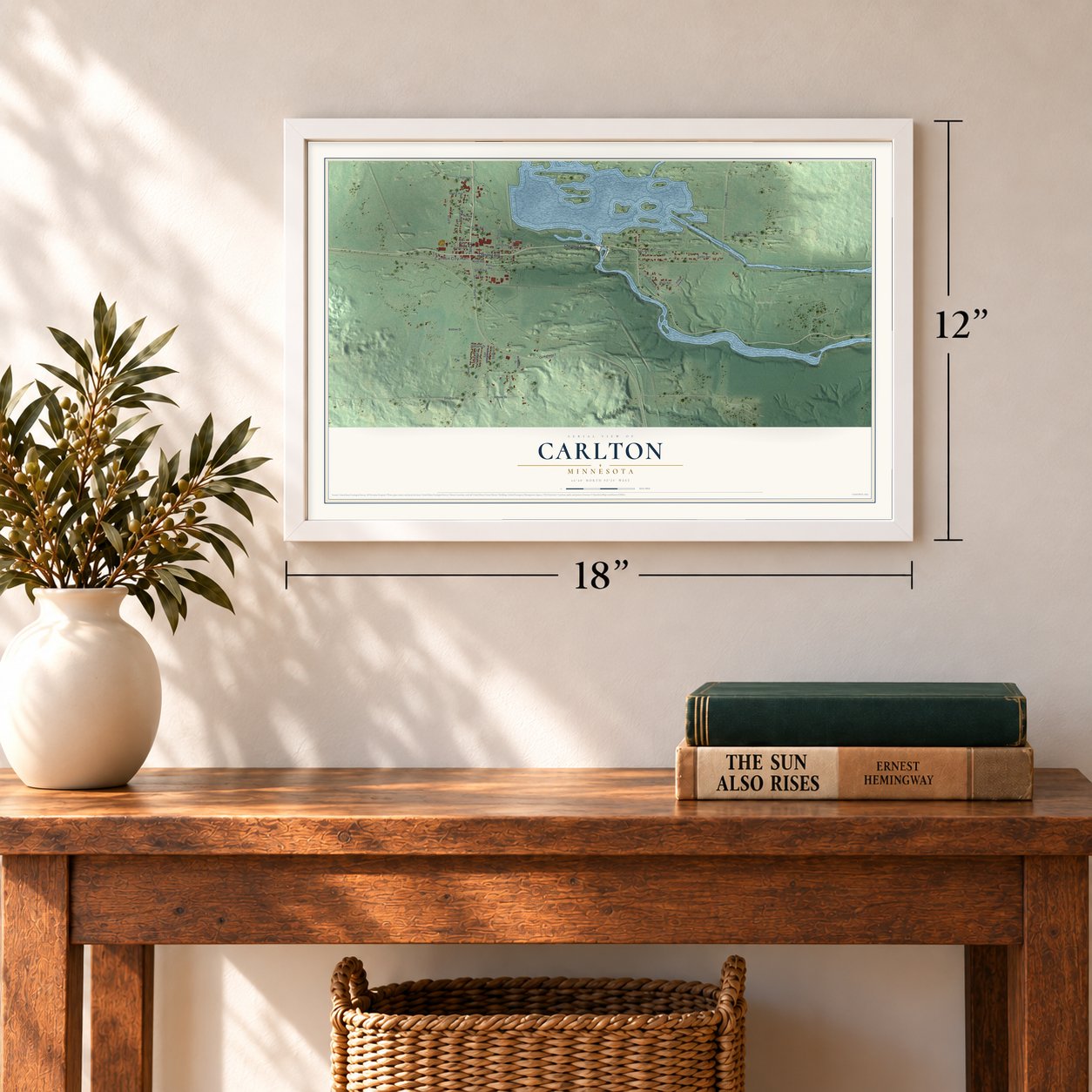 Carlton, Minnesota map, 12 x 18 inch print in a white frame in an entryway