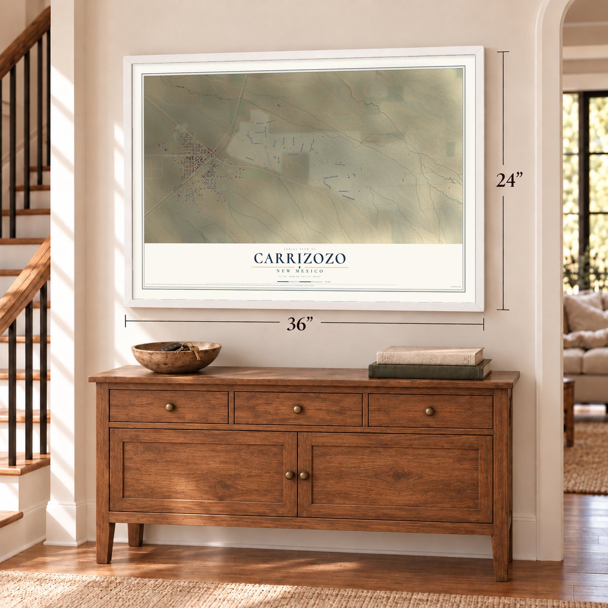 Carrizozo, New Mexico map, 24 x 36 inch print in a white frame above a dresser by a staircase