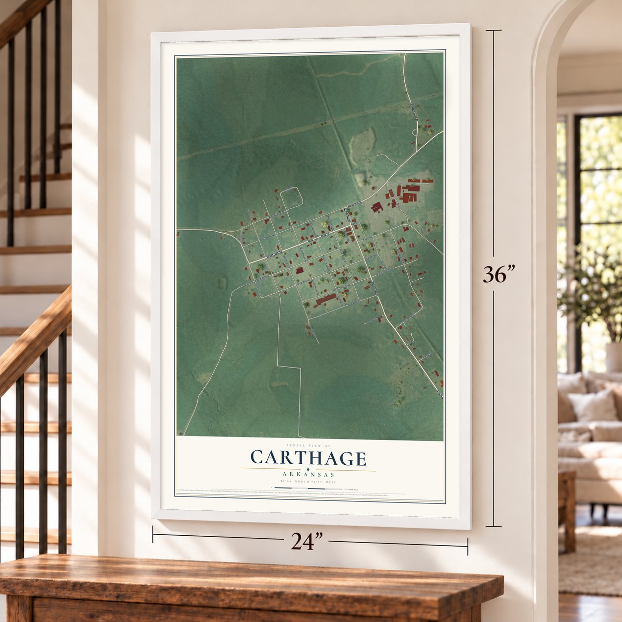 Carthage, Arkansas map, 24 x 36 inch print in a white frame by a staircase