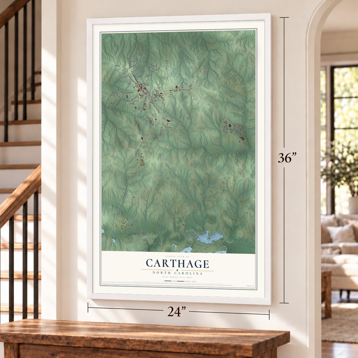 Carthage, North Carolina map, 24 x 36 inch print in a white frame by a staircase
