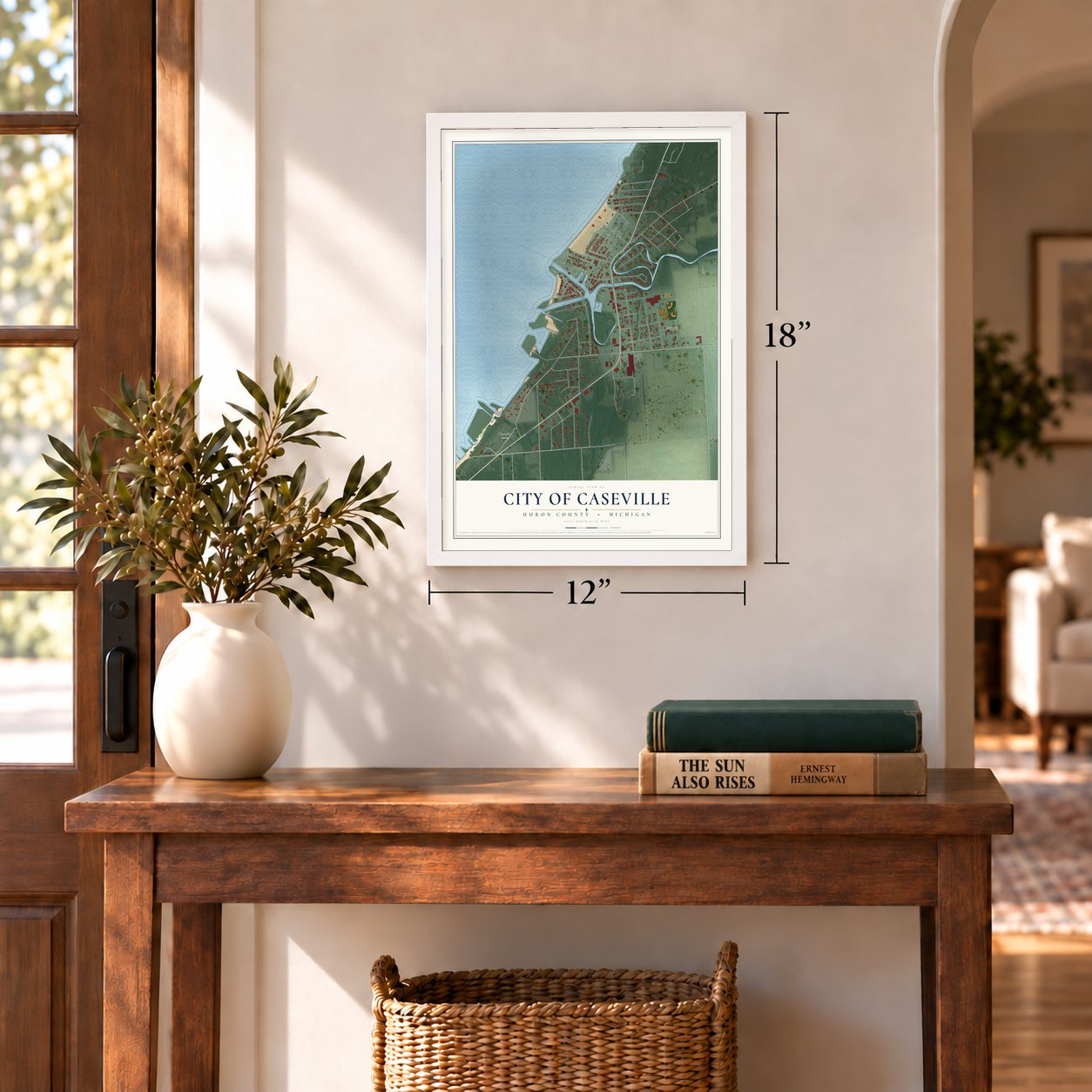 Caseville, Michigan map, 12 x 18 inch print in a white frame in an entryway