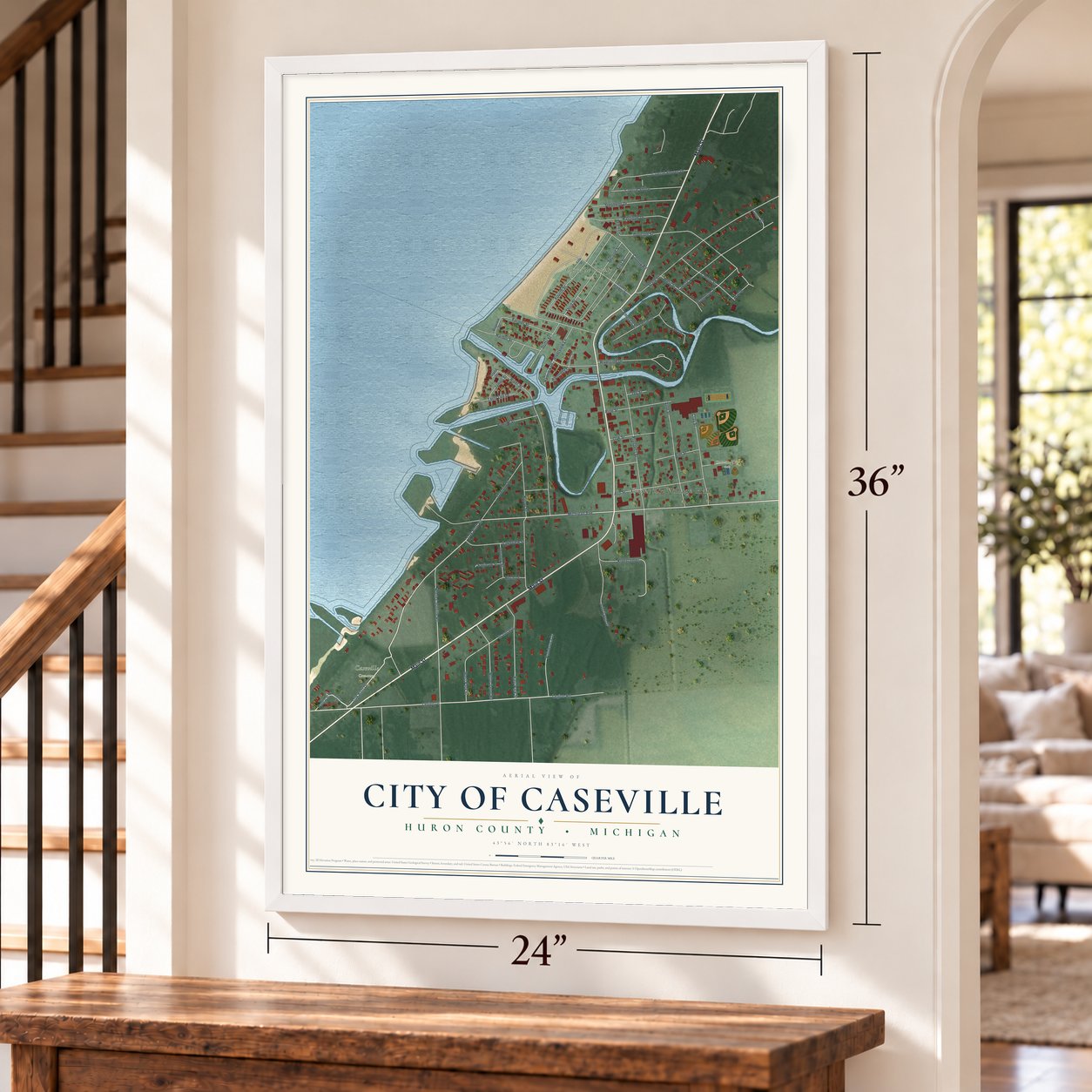 Caseville, Michigan map, 24 x 36 inch print in a white frame by a staircase