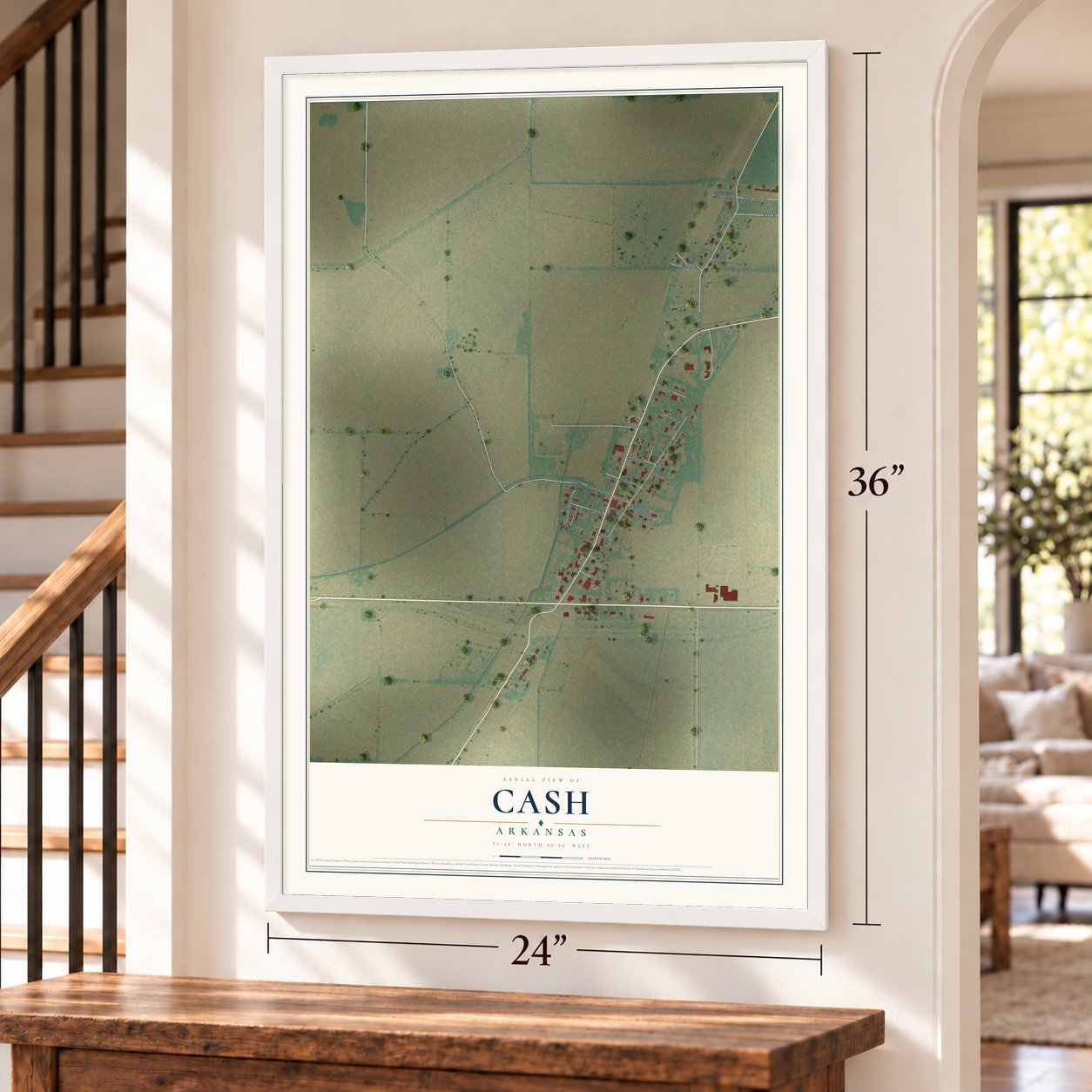 Cash, Arkansas map, 24 x 36 inch print in a white frame by a staircase