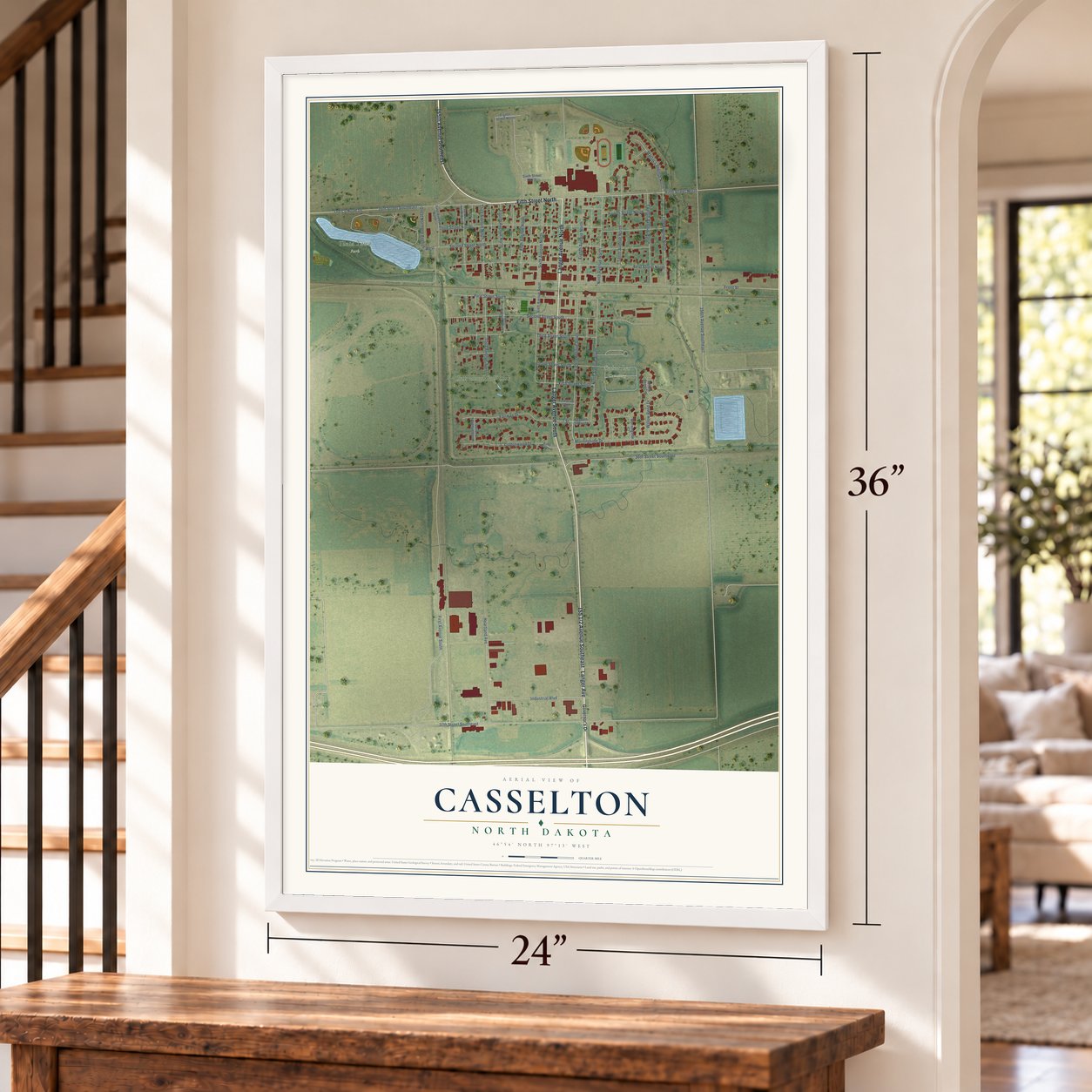 Casselton, North Dakota map, 24 x 36 inch print in a white frame by a staircase