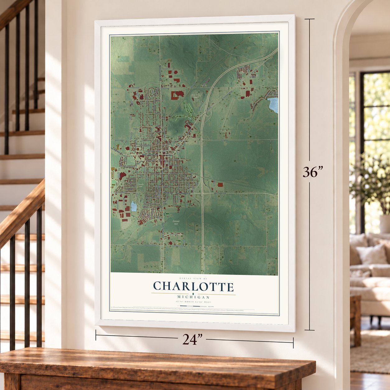 Charlotte, Michigan map, 24 x 36 inch print in a white frame by a staircase
