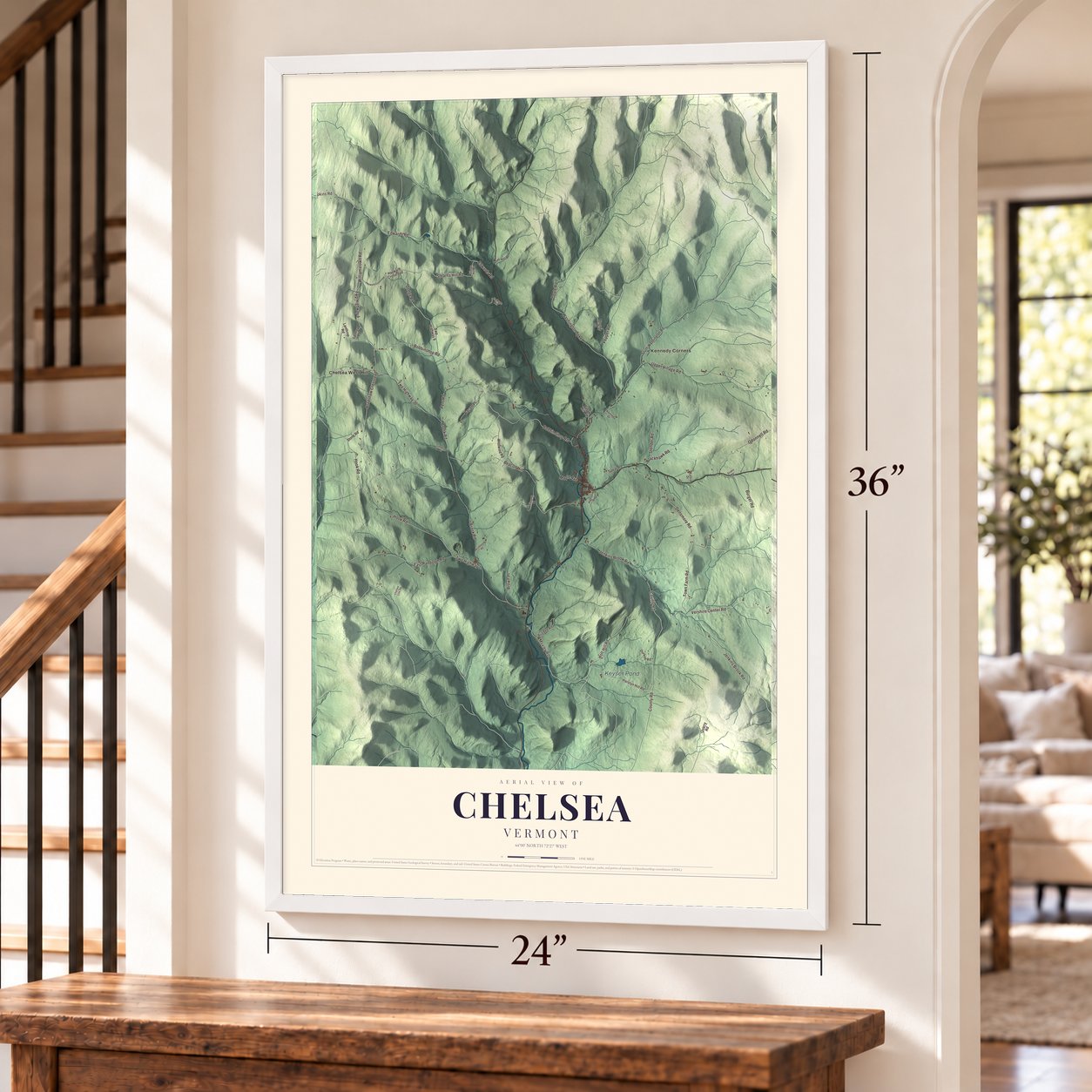 Chelsea, Vermont map, 24 x 36 inch print in a white frame by a staircase