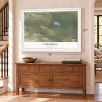 Cimarron, New Mexico map, 24 x 36 inch print in a white frame above a dresser by a staircase