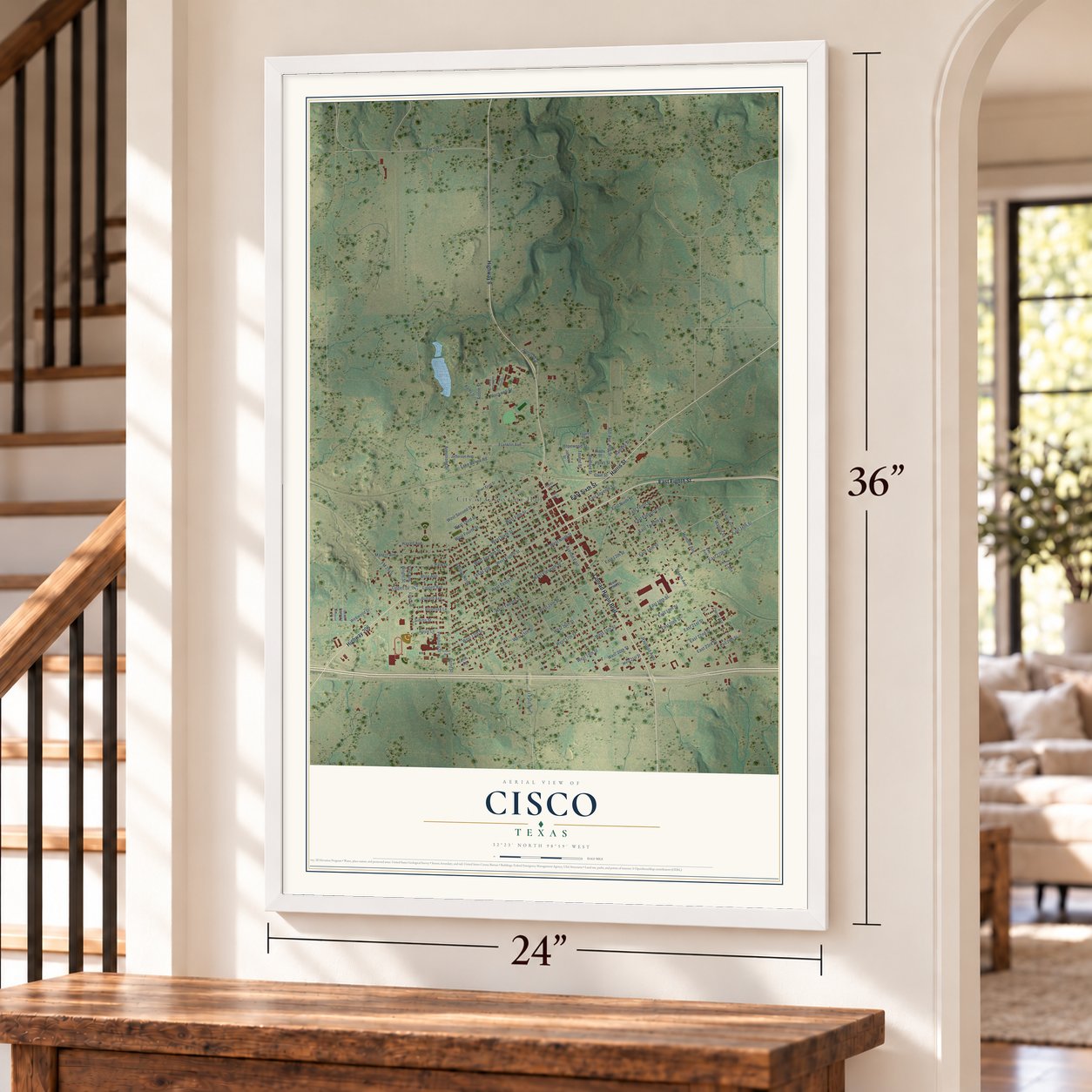 Cisco, Texas map, 24 x 36 inch print in a white frame by a staircase